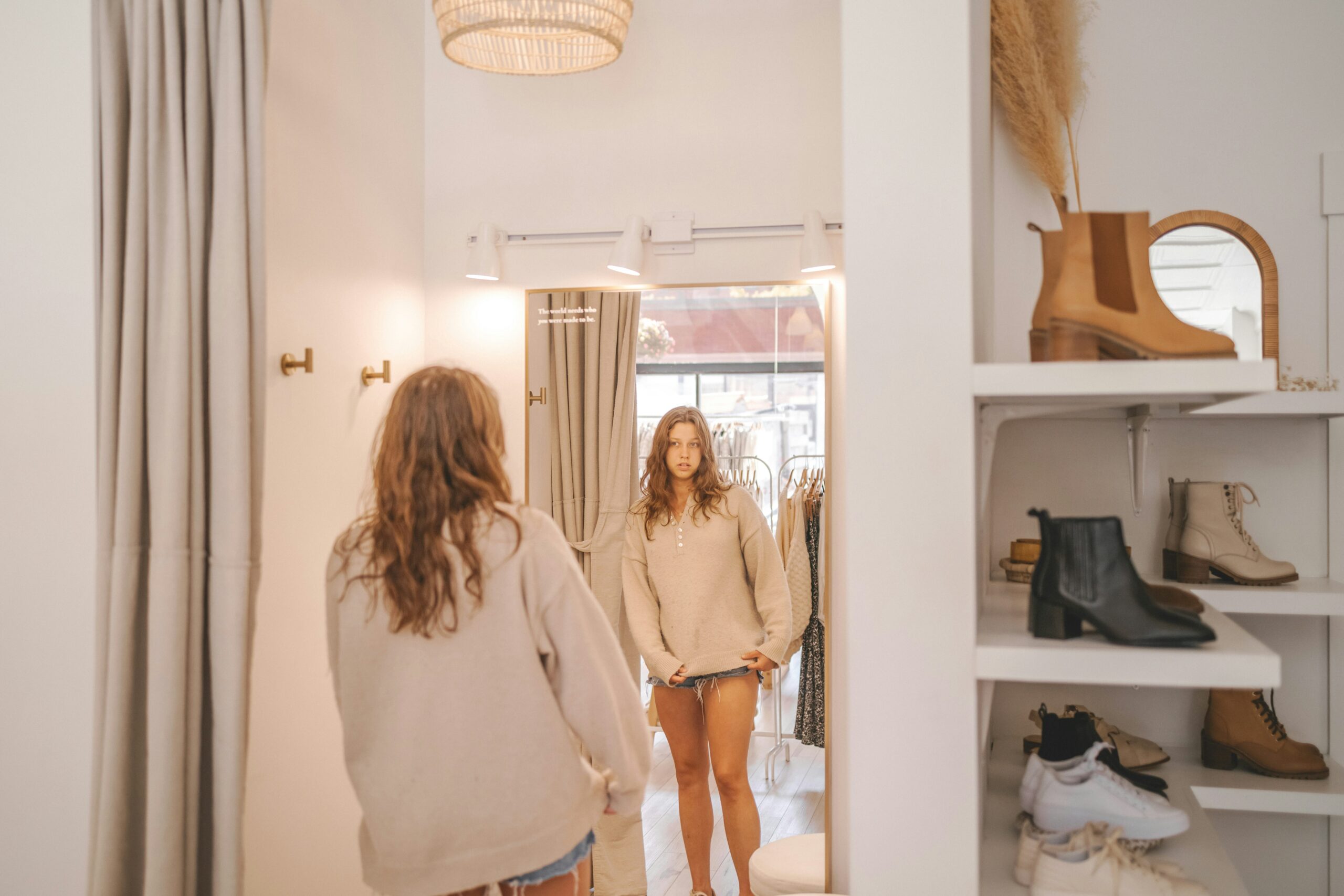 understanding-video-commerce-benefits-fashion-retailers -woman standing in front of the mirror