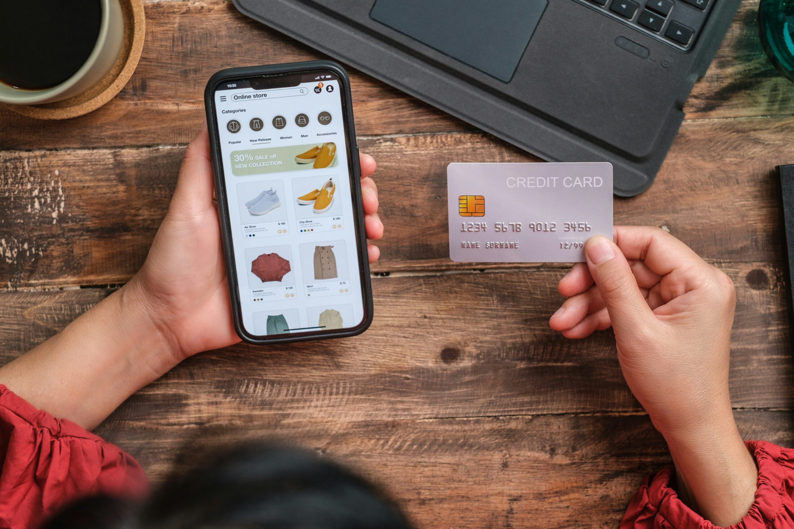 ecommerce-optimization-guide-lady holding a phone and a card