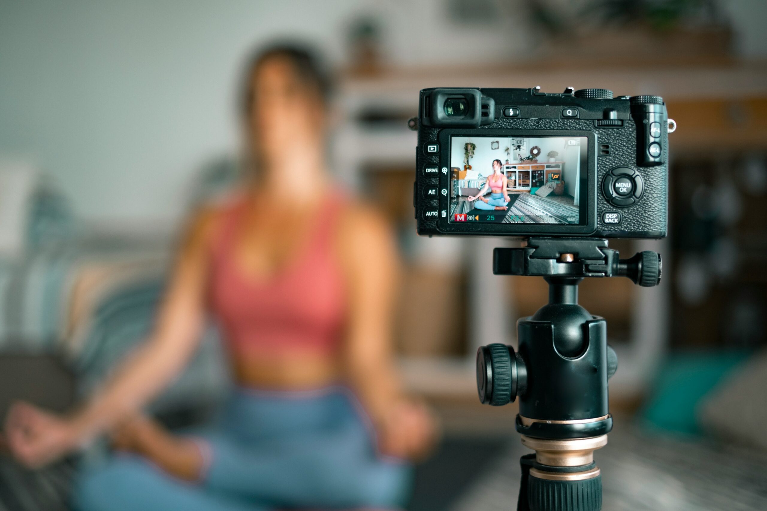 how-create-ecommerce-video-seo-strategy-woman doing yoga recording a video